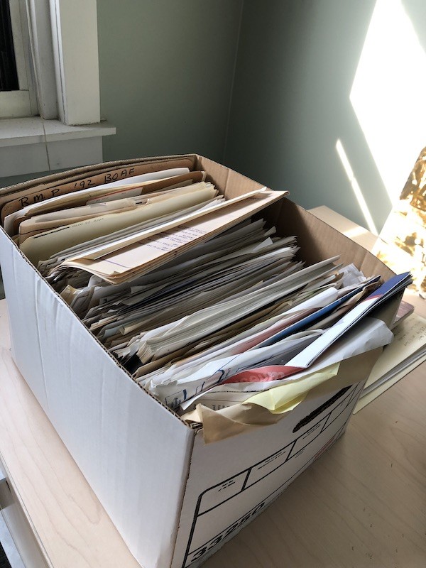 Pictured is one of the Preservation Specialist’s boxes that has yet to be rehoused. The papers within are in a state of disarray.