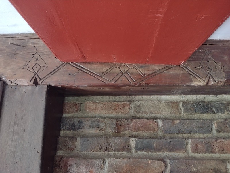 beam with carvings that is displayed in the meriam house