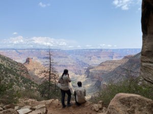 two outdoor entuisiasts taking in the grand canyon