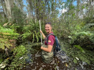 ACE Member Julia Izzo stands in the cypress swamp. Photo credit: Ian Jin/USFWS