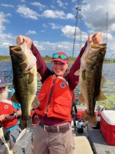 ACE Member Julia Izzo holds two largemouth bass caught during electrofishing surveys. Photo credit: Eddie Perri/USFWS