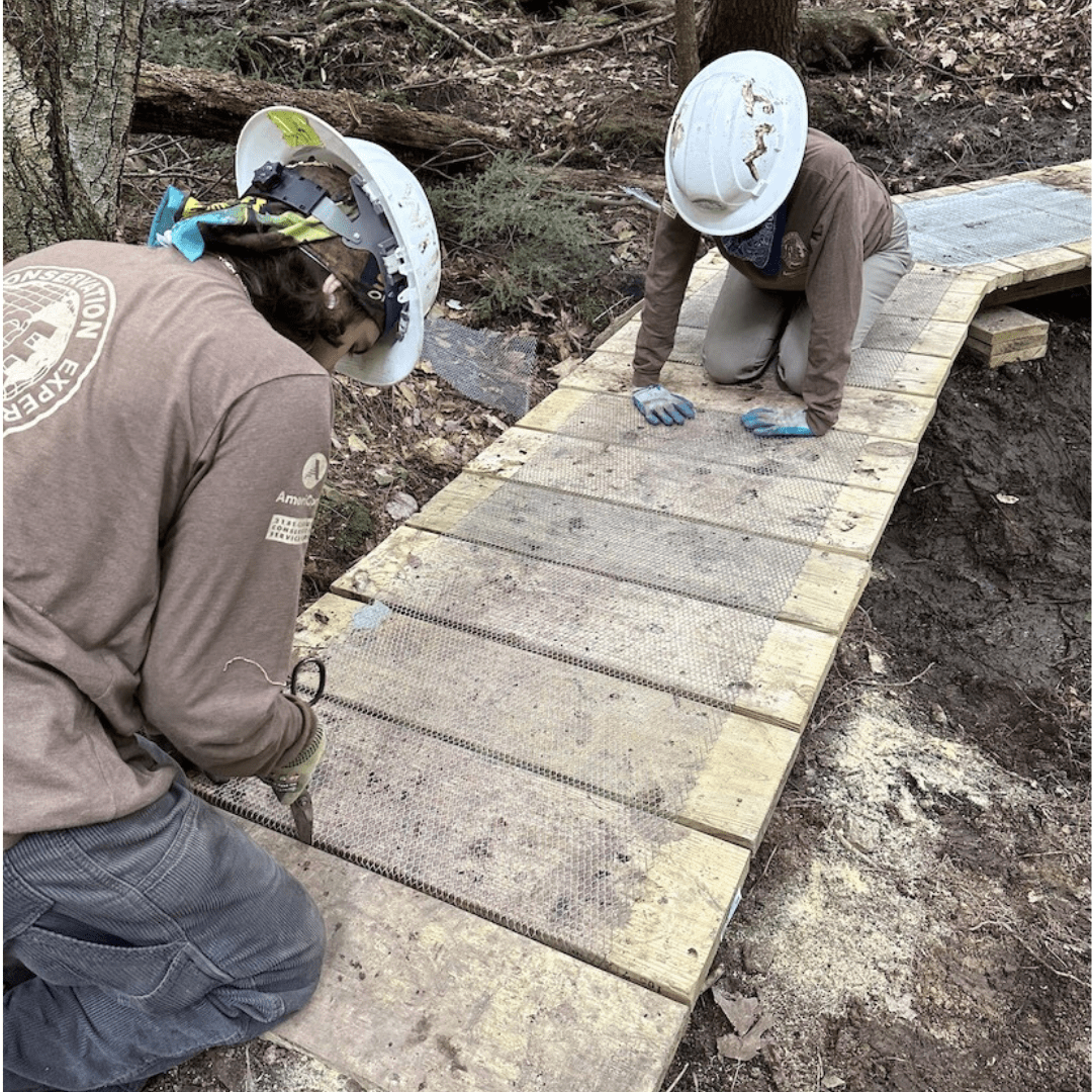 ACE members building foot bridge image