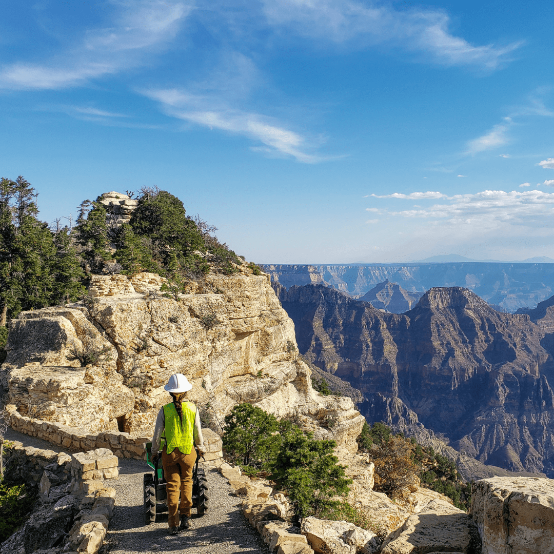 Crew member working in canyon image