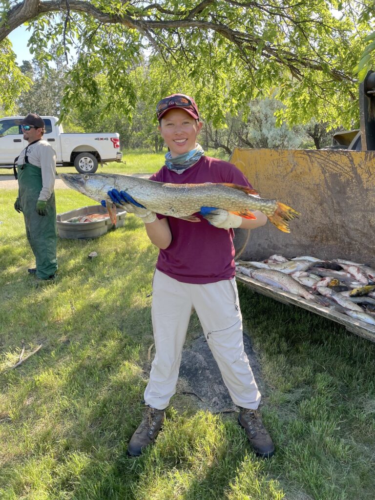 ACE member holding a fish