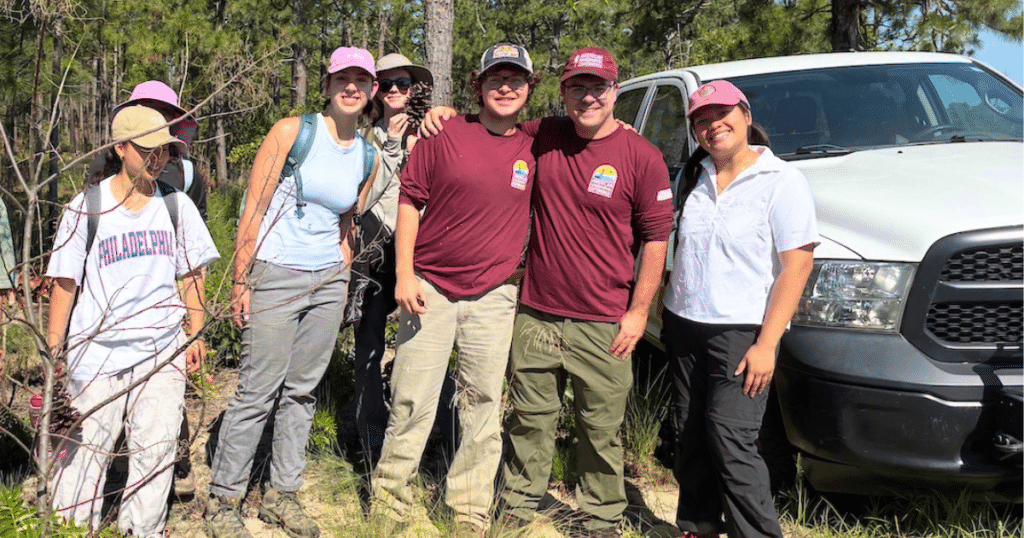 Micah with volunteers photo