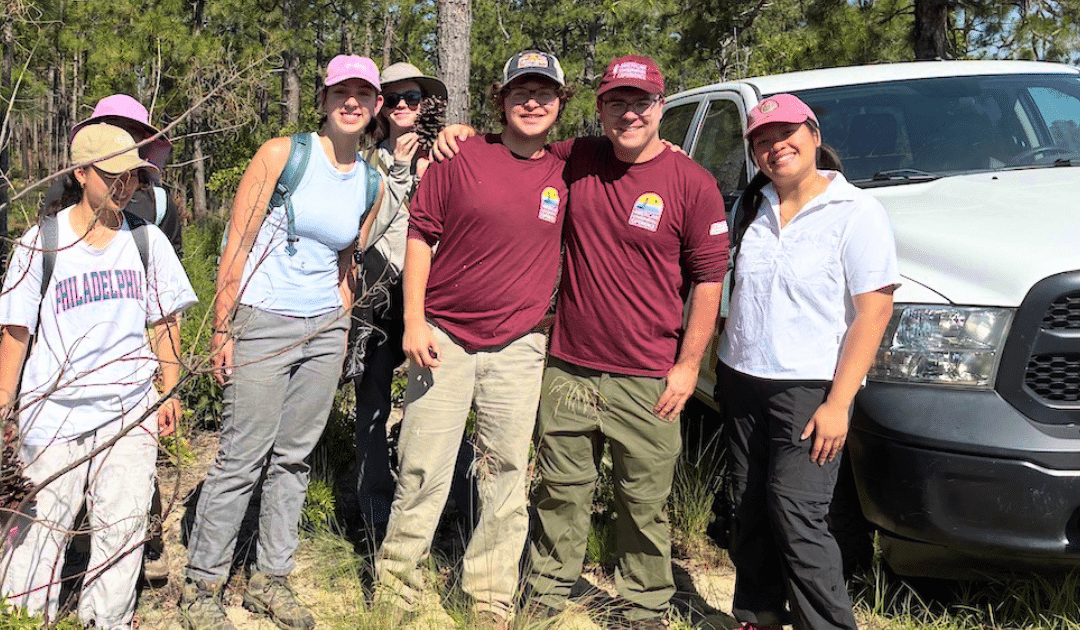 Micah with volunteers photo