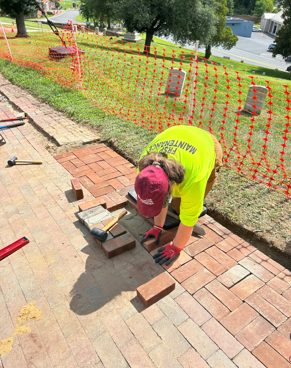 Anastasia Camarca laying brick photo of EPIC member laying brick